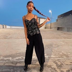 90s jumpsuit 
Labeled size 9
Runs small
Would best fit size medium 7/8